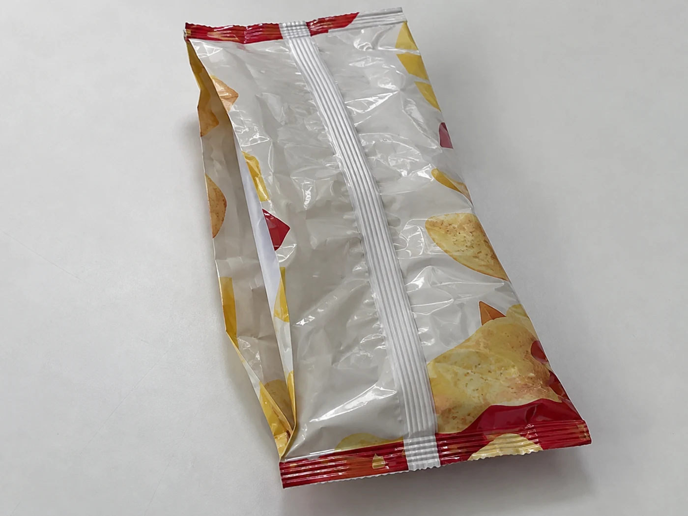 Flat empty center seal gusset bags with snacks artwork