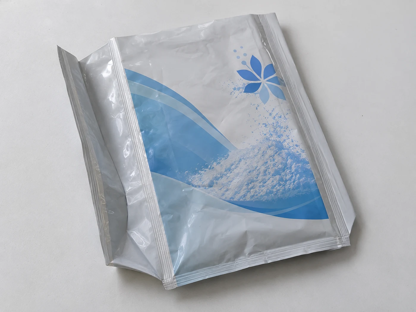 Flat empty quad seal gusset bags with daily powder artwork